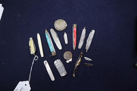 Fifteen silver, ivory, malachite and other folding penknives, including multi-function and miniature examples.